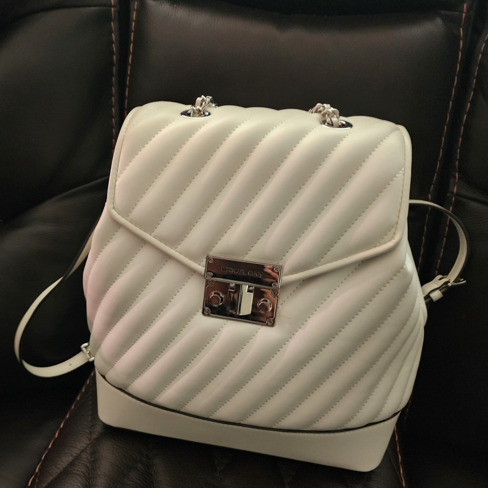 Michael Kors white quilted backpack.